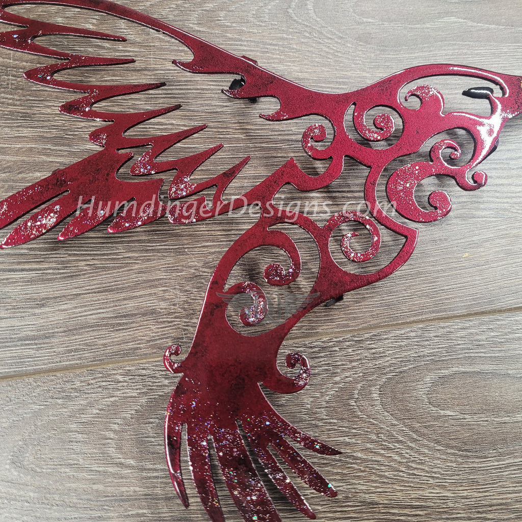 Hand-painted metal art hummingbird wall decor in vibrant red, showcasing intricate designs and premium quality craftsmanship.