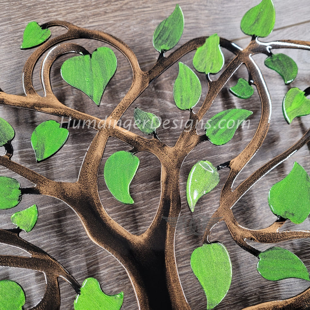 Handcrafted Infinity Tree of Life metal art with vibrant green leaves, showcasing premium quality and unique design.